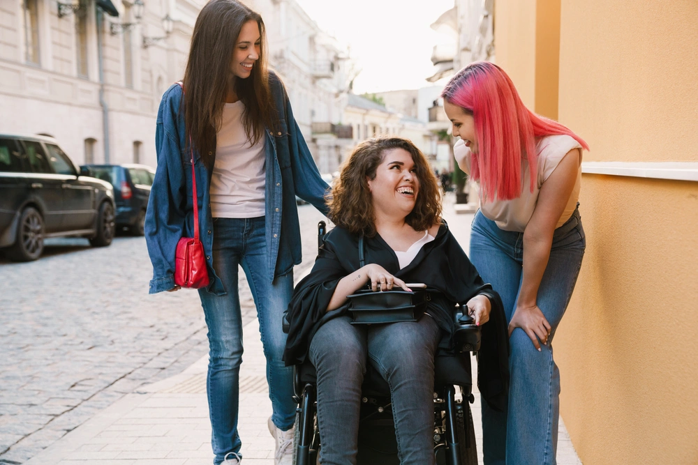 friends with a disabled women on wheelchair